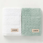 Set 4 prosoape de baie alb-acvamarin din bumbac 100%